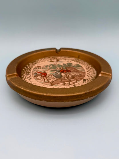 Florentine landscape ashtray shown from a side profile angle, gray background