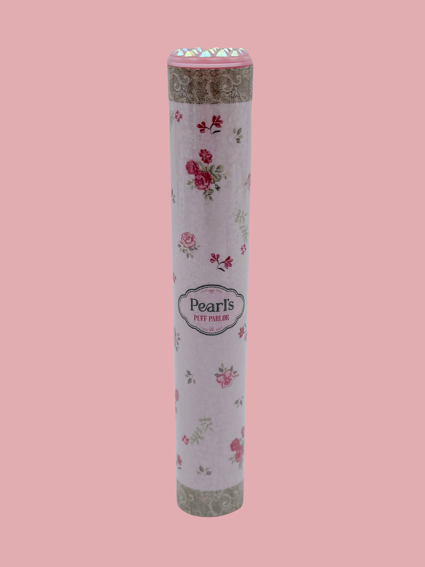 Single pink rose floral doob tube with rhinestone lid standing upright on a pink background