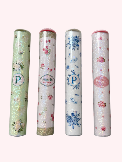 Four floral doob tubes with holographic finish and rhinestone lids standing side by side, in mint green, blue, and pink rose designs