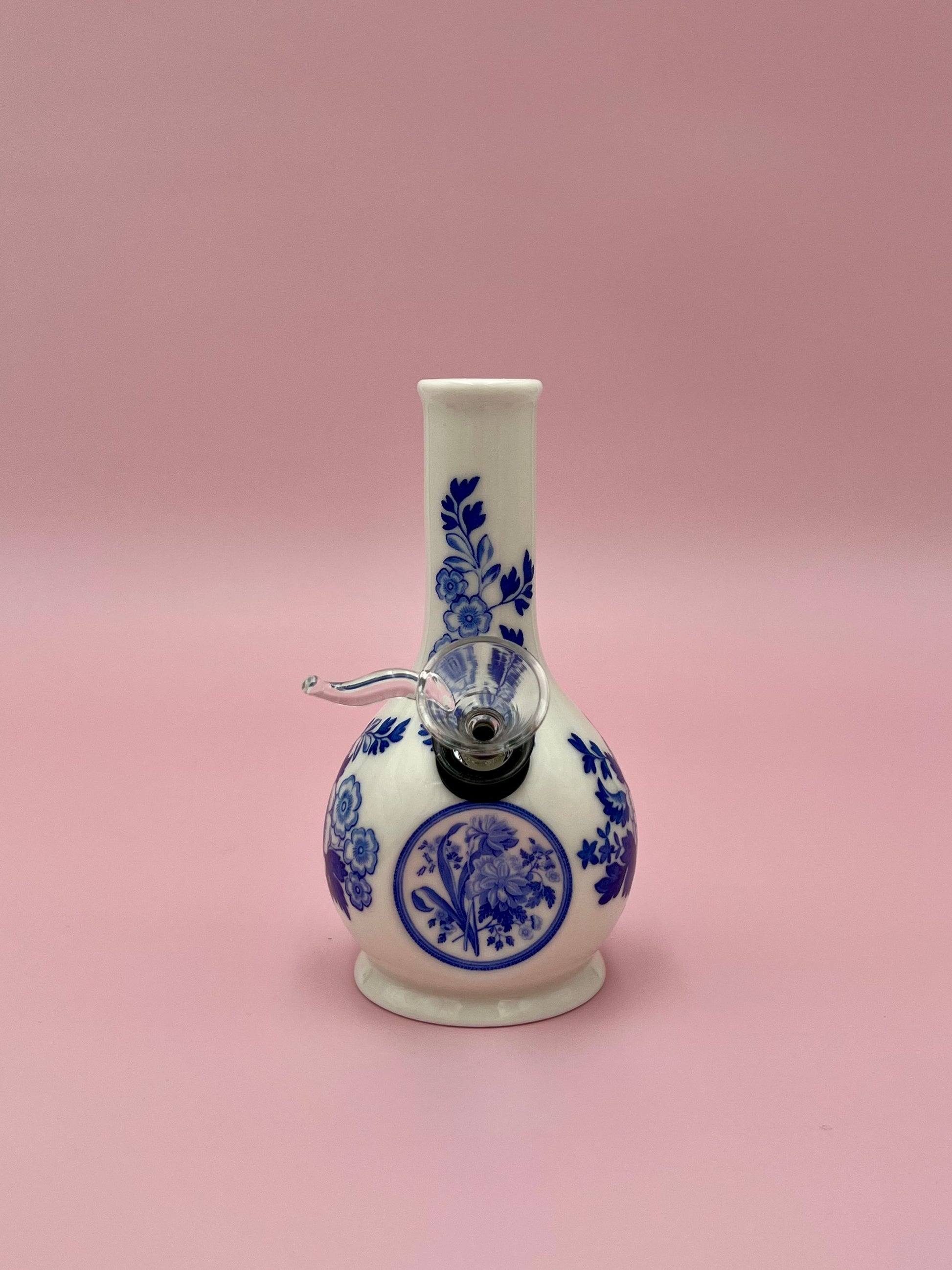 Front view of the Betty water pipe showing the cobalt blue floral pattern and center medallion more clearly, pink background.