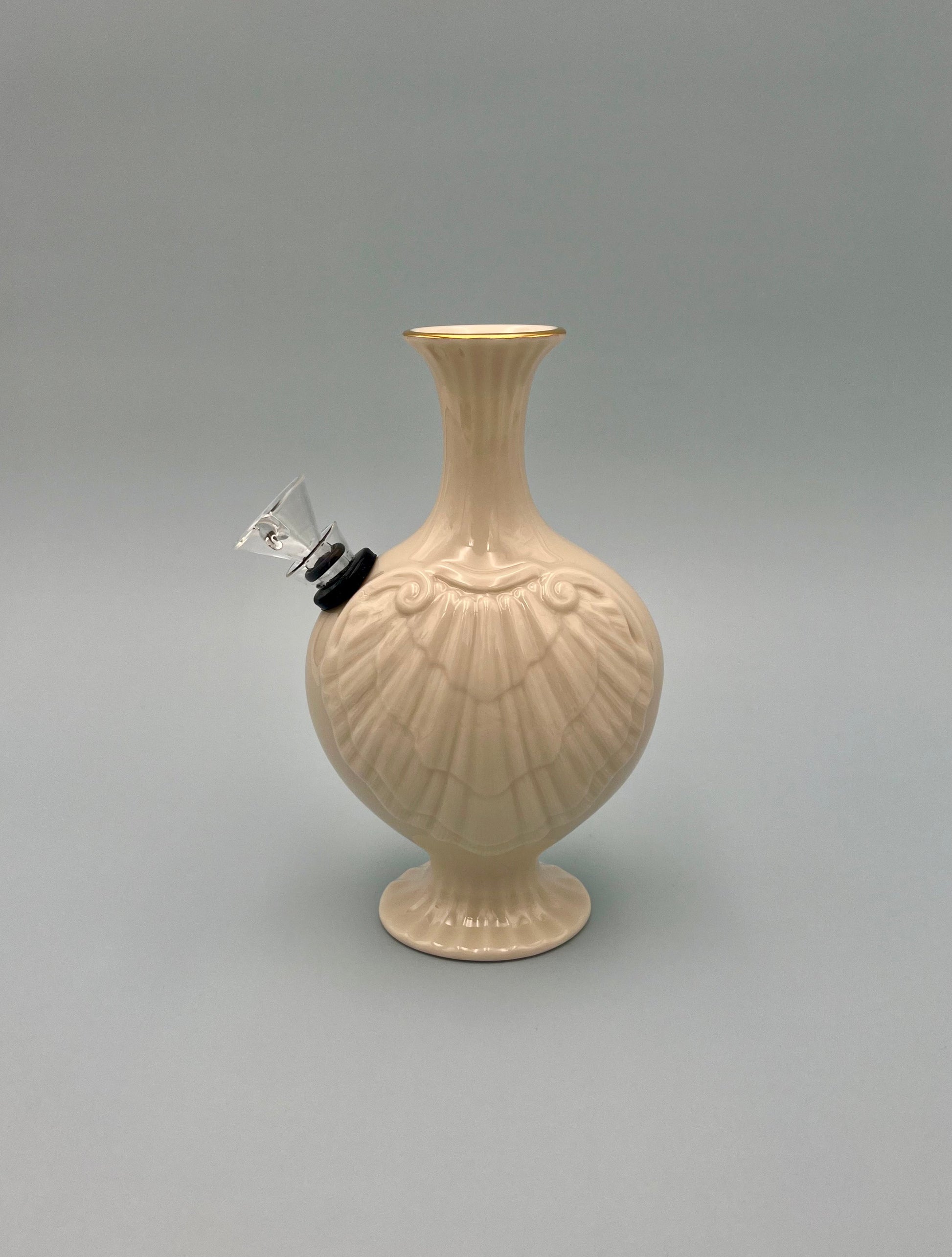 Angled view of the same ribbed bud vase water pipe, highlighting its fluted texture and glass bowl piece, gray background.