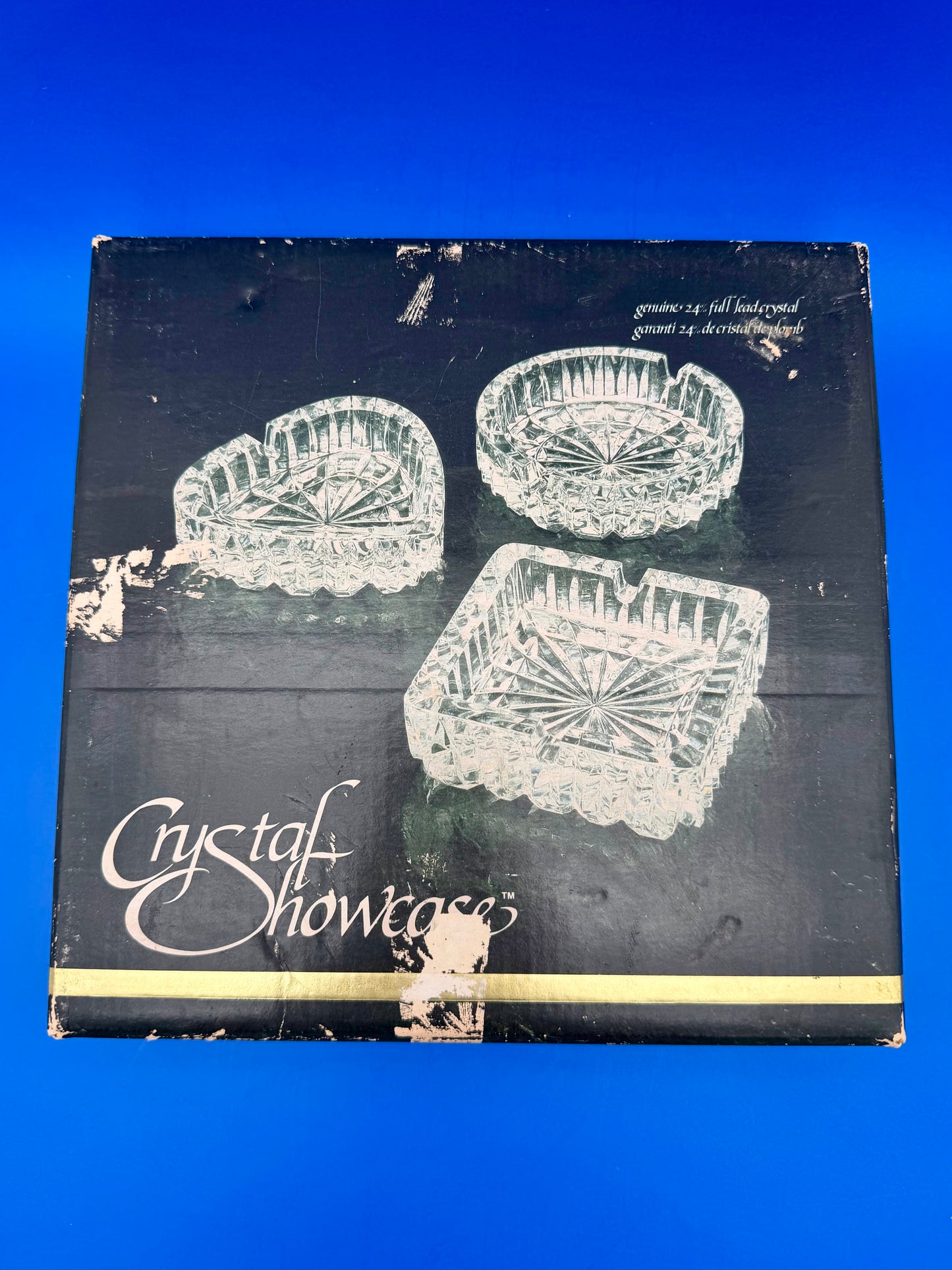 Vintage Crystal Showcase branded box lid illustrating the round, heart, and square faceted dishes, blue background