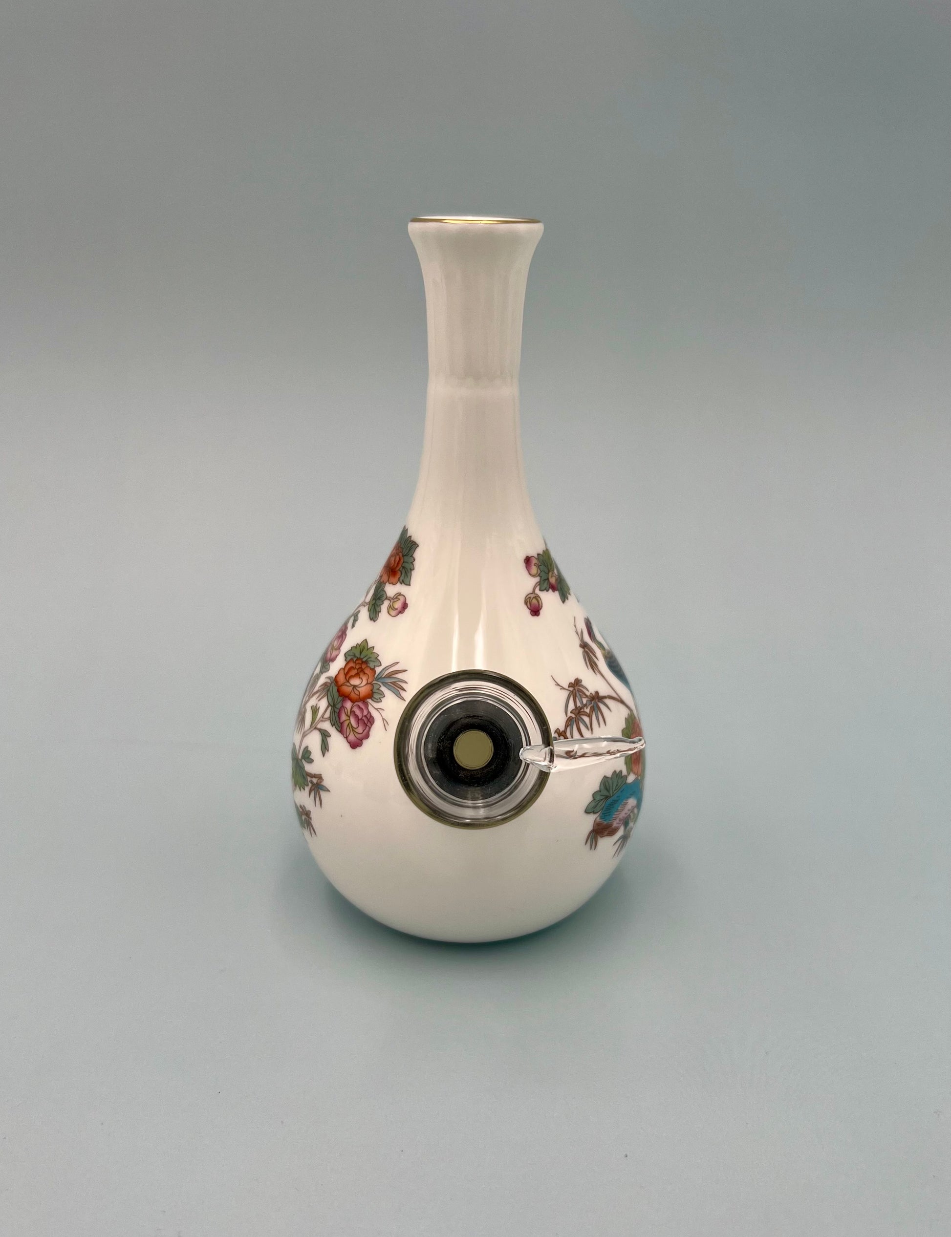 White bone china bud vase water pipe with a painted crane and floral design, shown from the front, gray background