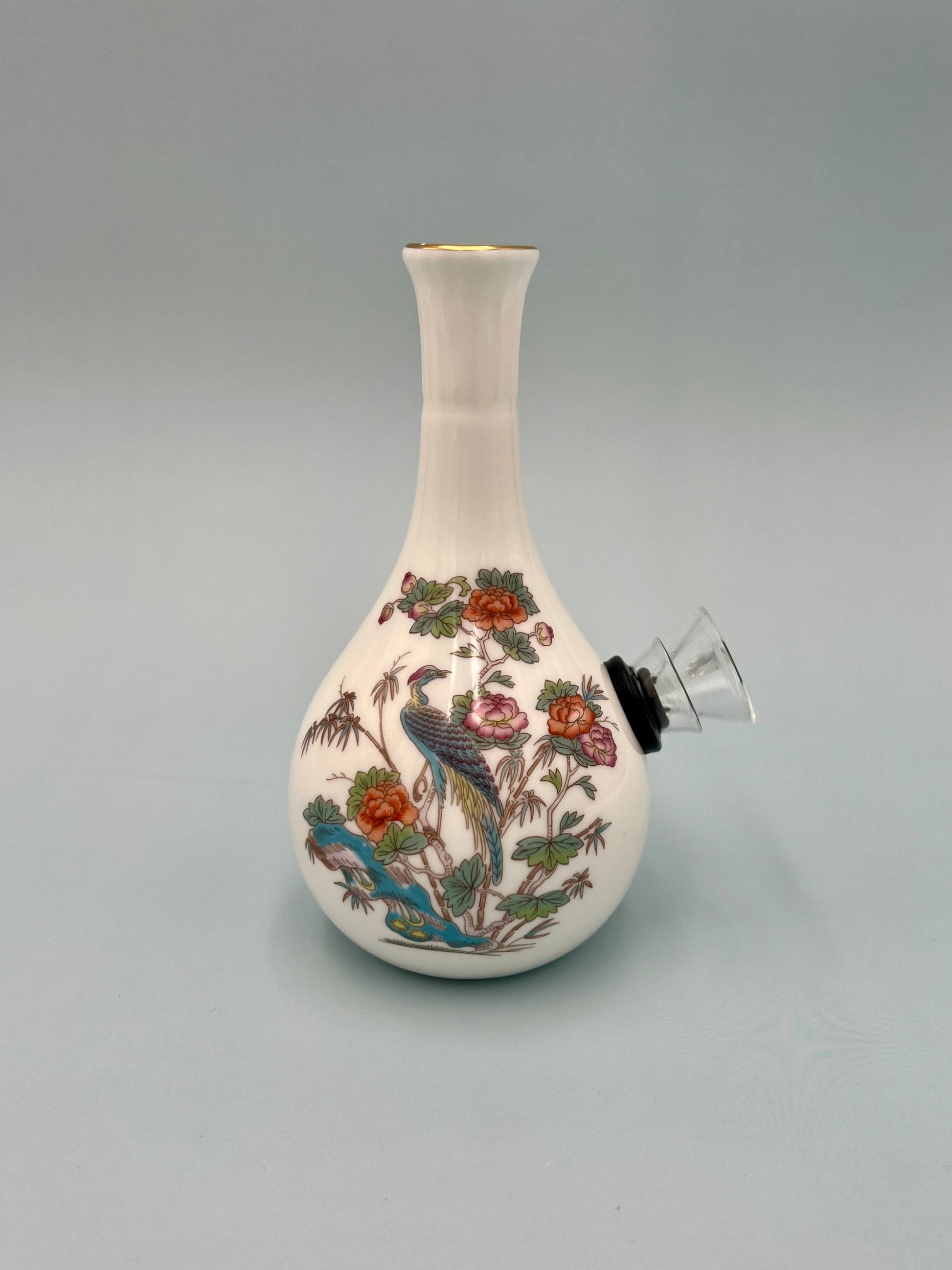 White bone china crane and floral bud vase water pipe with the glass bowl piece attached, viewed from a different angle, gray background