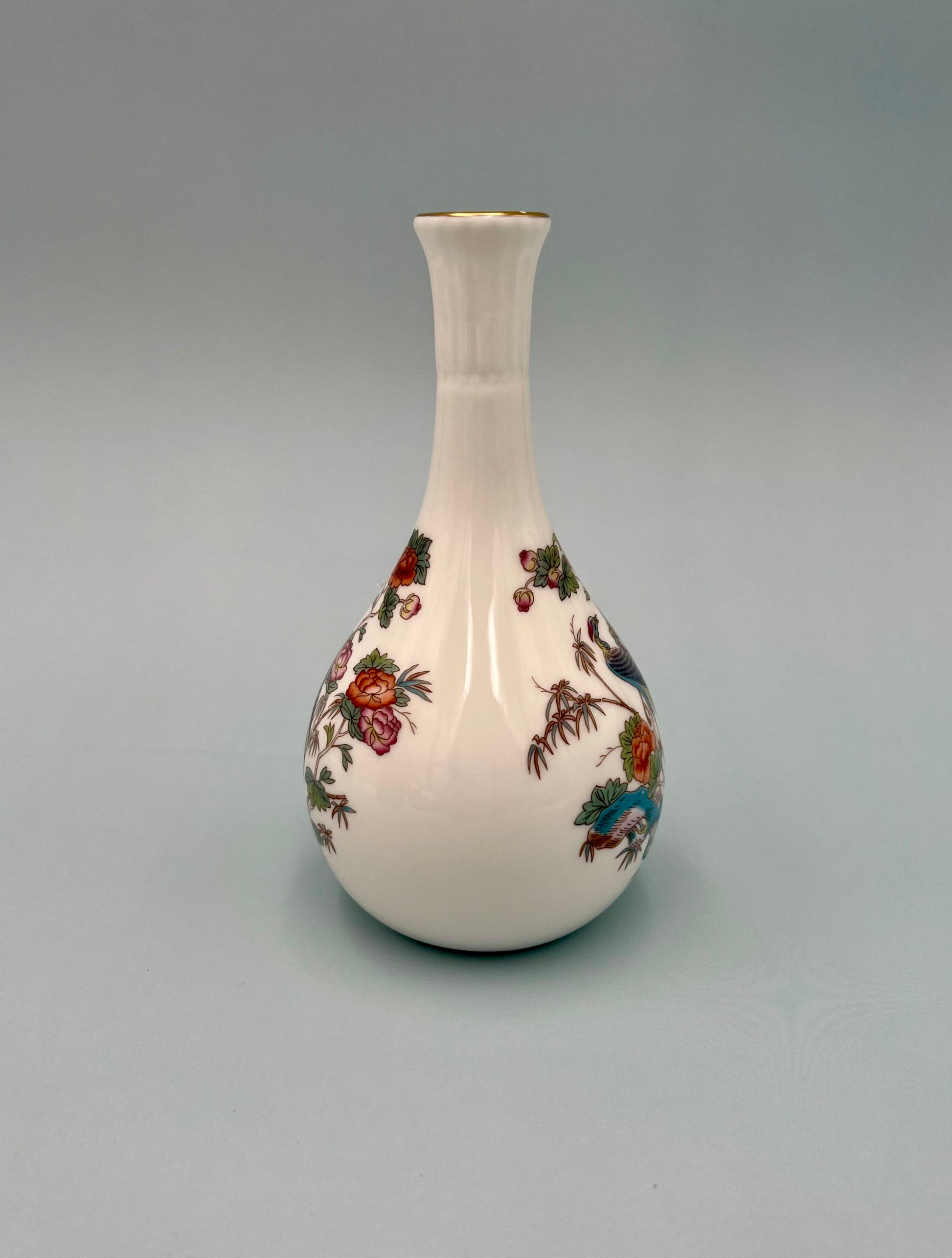 White bone china crane and floral bud vase water pipe shown without the bowl piece attached, gray background