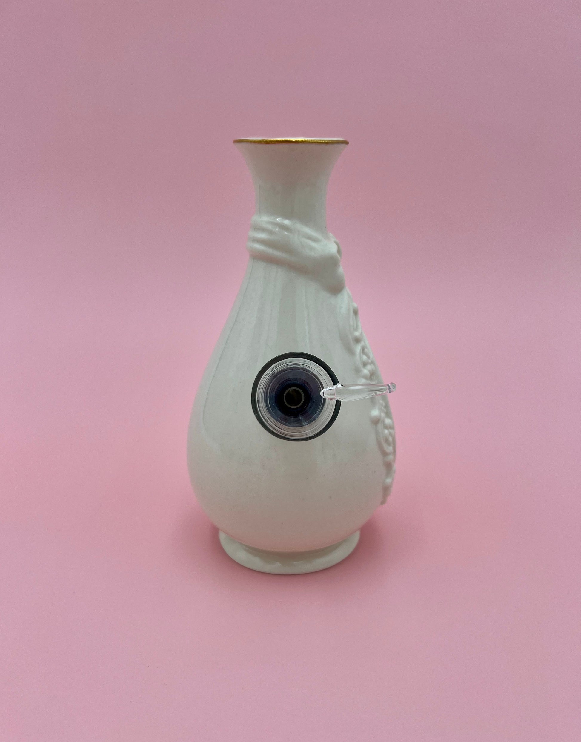 Back view of the Louise water pipe showing its smooth reverse side and gold-trimmed neck, pink background.