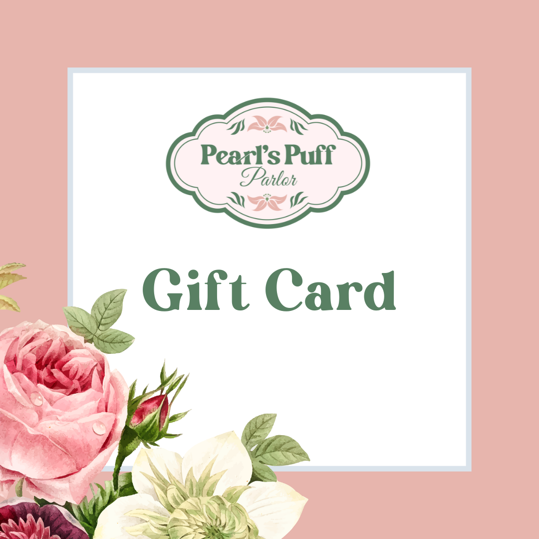 Pearl's Puff Parlor gift card design featuring the shop logo on a white card bordered with pink roses and white flowers, dusty rose background.
